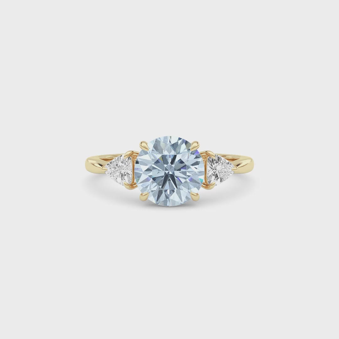 Yellow gold Three-Stone Fancy Blue Round Cut Diamond Ring with Trillion Side Stones