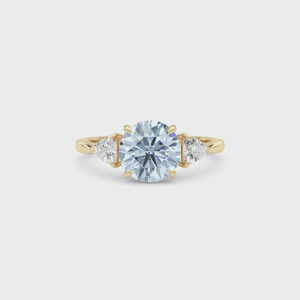 Yellow gold Three-Stone Fancy Blue Round Cut Diamond Ring with Trillion Side Stones