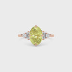 Rose gold Fancy Yellow Oval Cut Three Stone Diamond Engagement Ring with Tapered Baguette and Round Side Stones