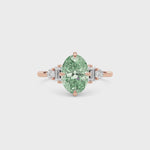 Rose gold Fancy Green Oval Cut Three Stone Diamond Engagement Ring with Tapered Baguette and Round Side Stones