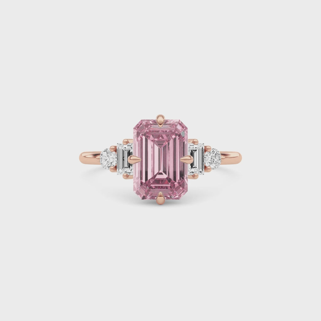 Rose gold Fancy Pink Emerald Cut Three Stone Diamond Engagement Ring with Tapered Baguette and Round Side Stones