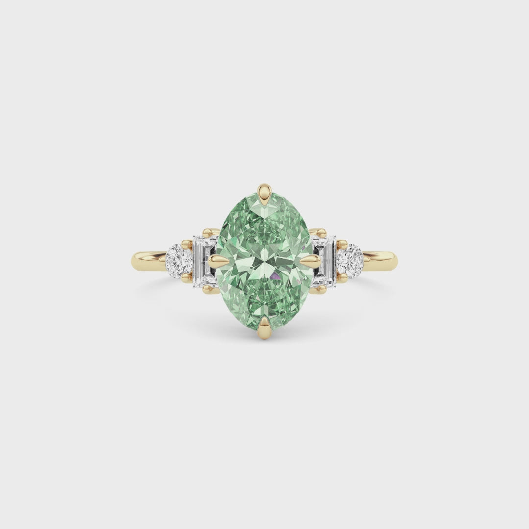 Yellow gold Fancy Green Oval Cut Three Stone Diamond Engagement Ring with Tapered Baguette and Round Side Stones