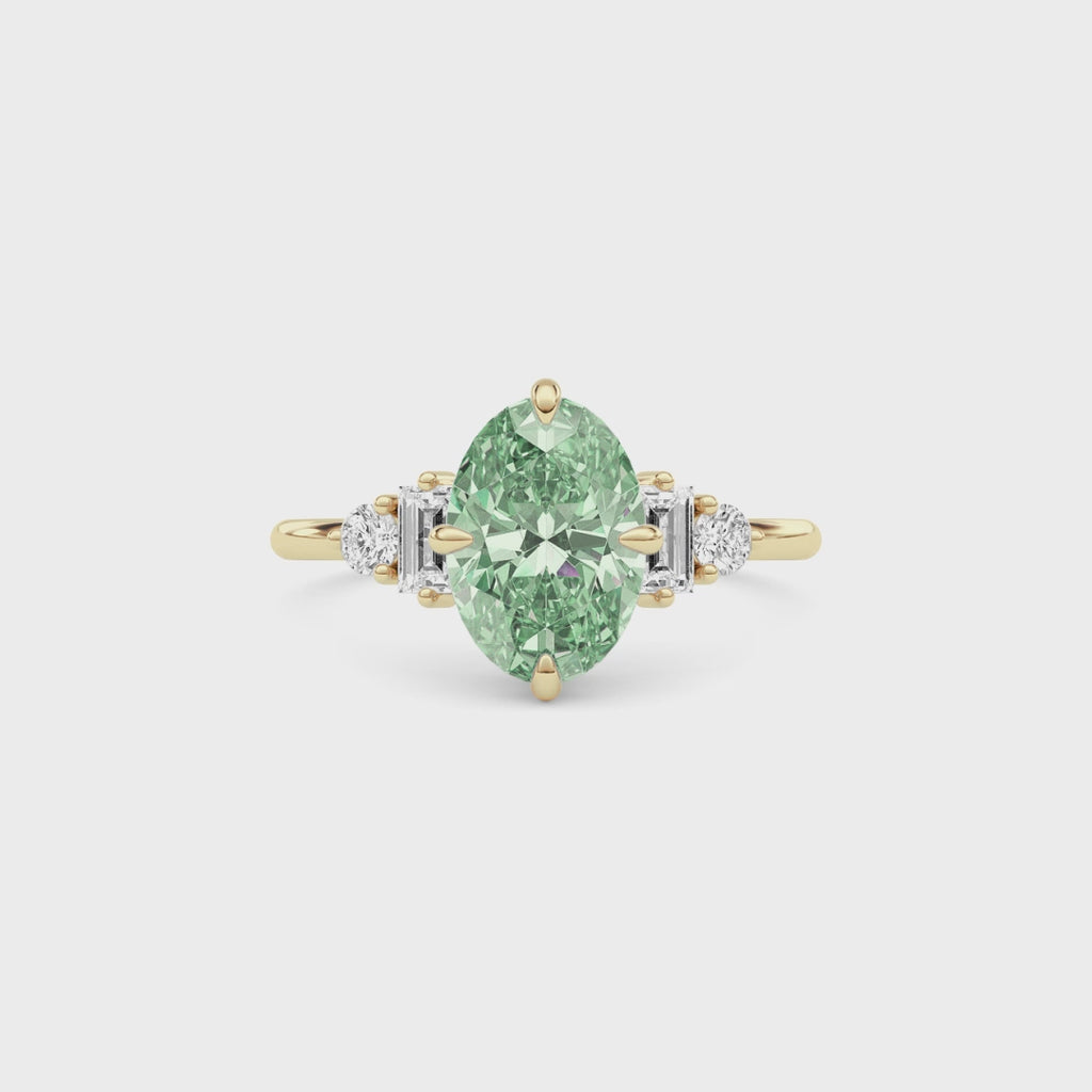 Yellow gold Fancy Green Oval Cut Three Stone Diamond Engagement Ring with Tapered Baguette and Round Side Stones