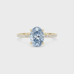 Yellow gold Fancy Blue Oval Cut Diamond Solitaire with Pavé Band