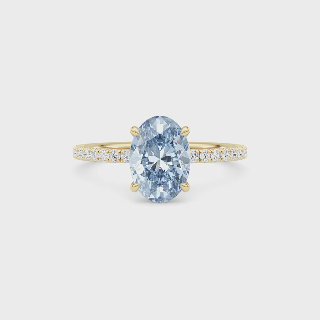 Yellow gold Fancy Blue Oval Cut Diamond Solitaire with Pavé Band