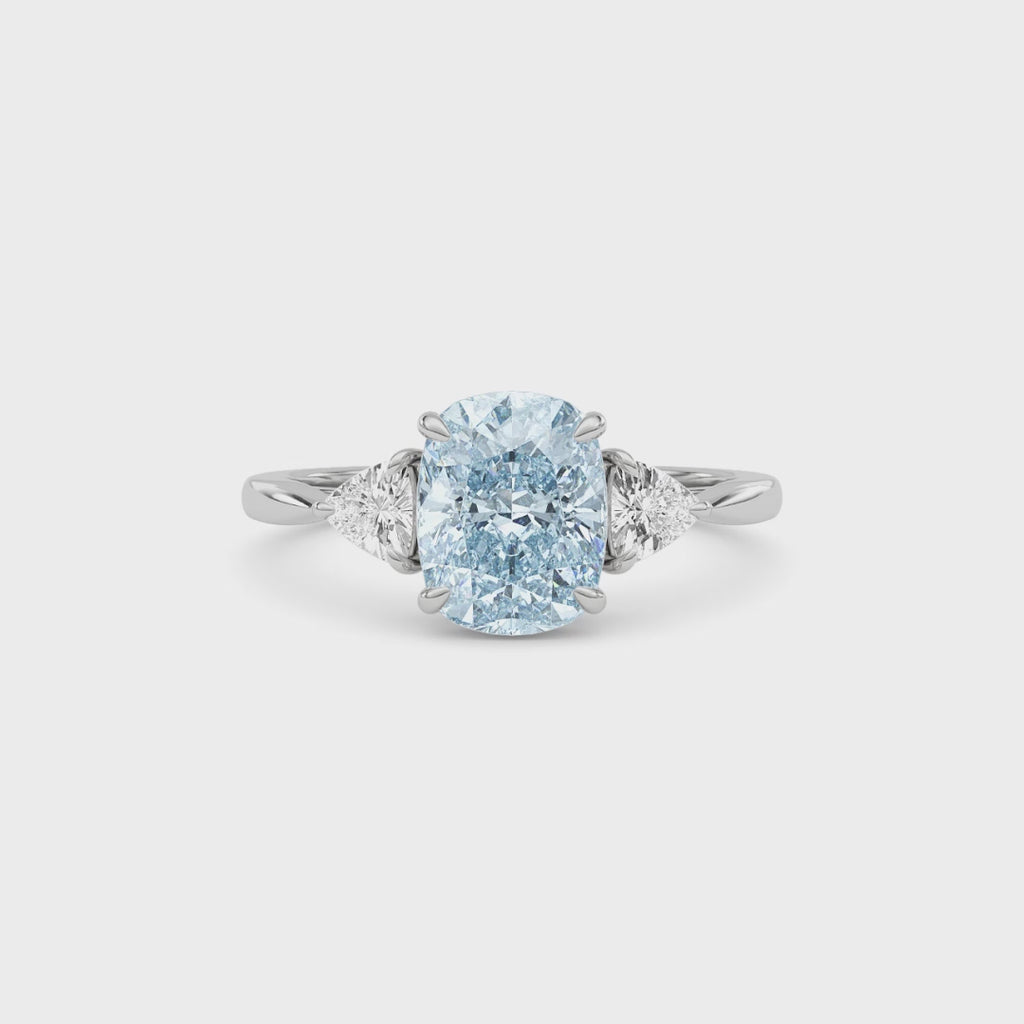 Platinum Three-Stone Fancy Blue Cushion Cut Diamond Ring with Trillion Side Stones
