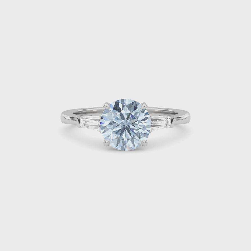 White gold Three-Stone Fancy Blue Round Cut Diamond Ring with Tapered Baguette Side Stones