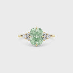 Yellow gold Fancy Green Cushion Cut Three Stone Diamond Engagement Ring with Tapered Baguette and Round Side Stones