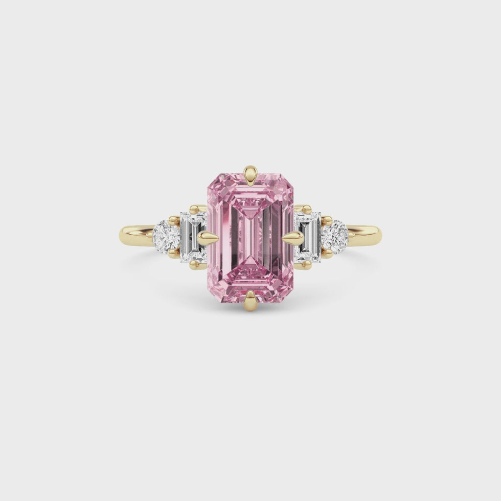 Yellow gold Three-Stone Fancy Pink Emerald Cut Diamond Ring with Heart Side Stones