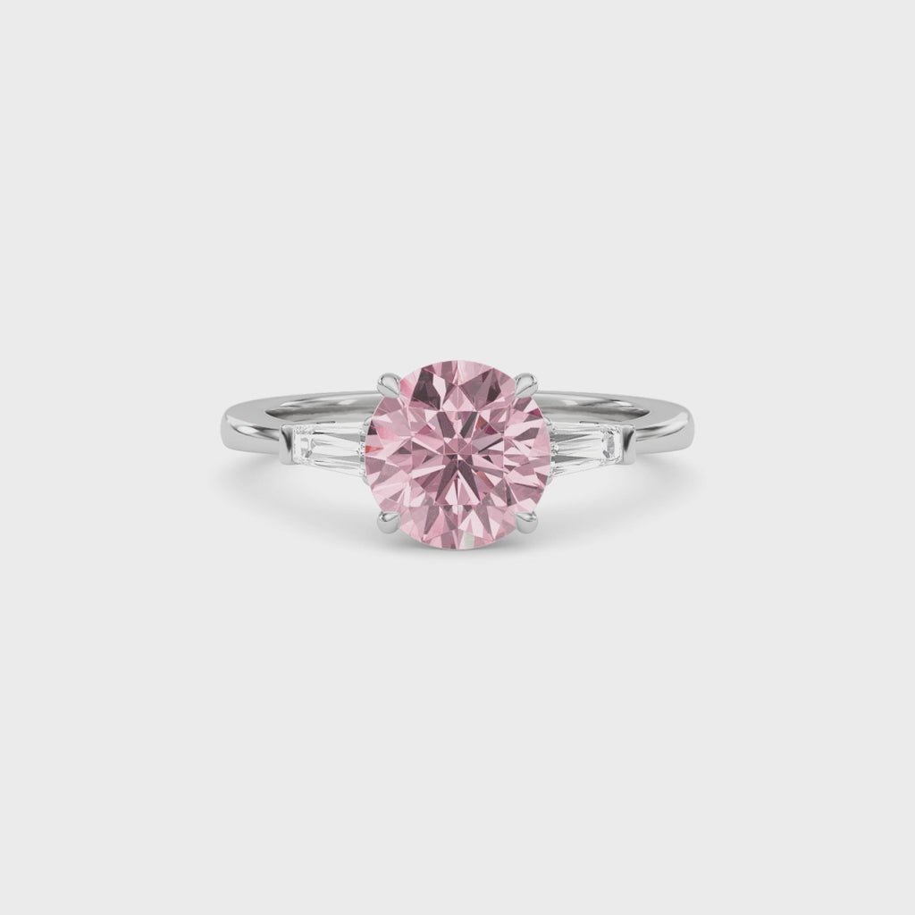 Platinum Three-Stone Fancy Pink Round Cut Diamond Ring with Tapered Baguette Side Stones