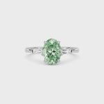 Platinum Three-Stone Fancy Green Oval Cut Diamond Ring with Tapered Baguette Side Stones