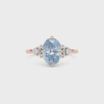 Rose gold Fancy Blue Oval Cut Three Stone Diamond Engagement Ring with Tapered Baguette and Round Side Stones