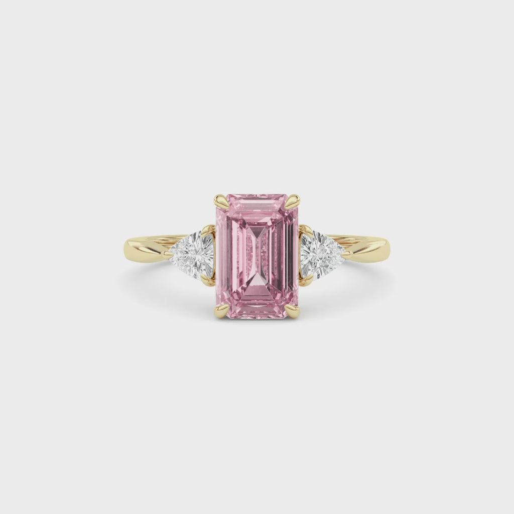 Yellow gold Three-Stone Fancy Pink Emerald Cut Diamond Ring with Trillion Side Stones