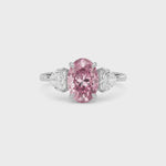 Platinum Three-Stone Fancy Pink Oval Cut Diamond Ring with Heart Side Stones