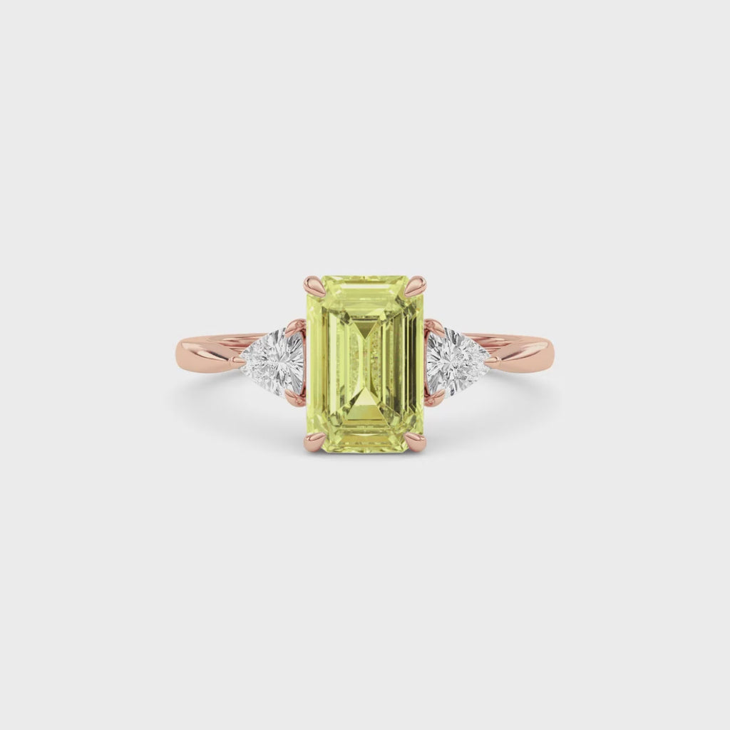 Rose gold Three-Stone Fancy Yellow Emerald Cut Diamond Ring with Trillion Side Stones
