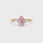 Yellow gold Three-Stone Fancy Pink Pear Cut Diamond Ring with Tapered Baguette Side Stones