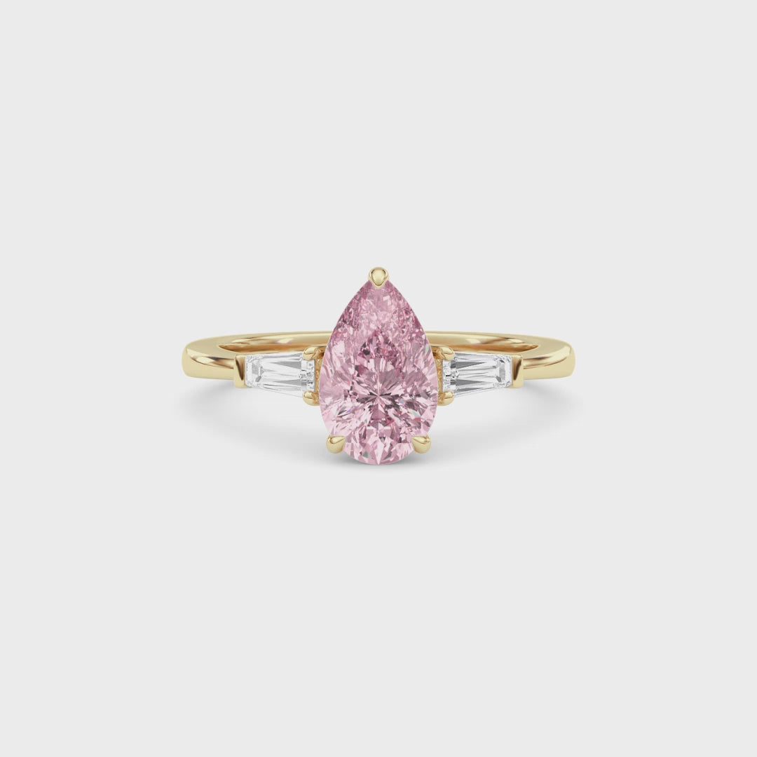 Yellow gold Three-Stone Fancy Pink Pear Cut Diamond Ring with Tapered Baguette Side Stones