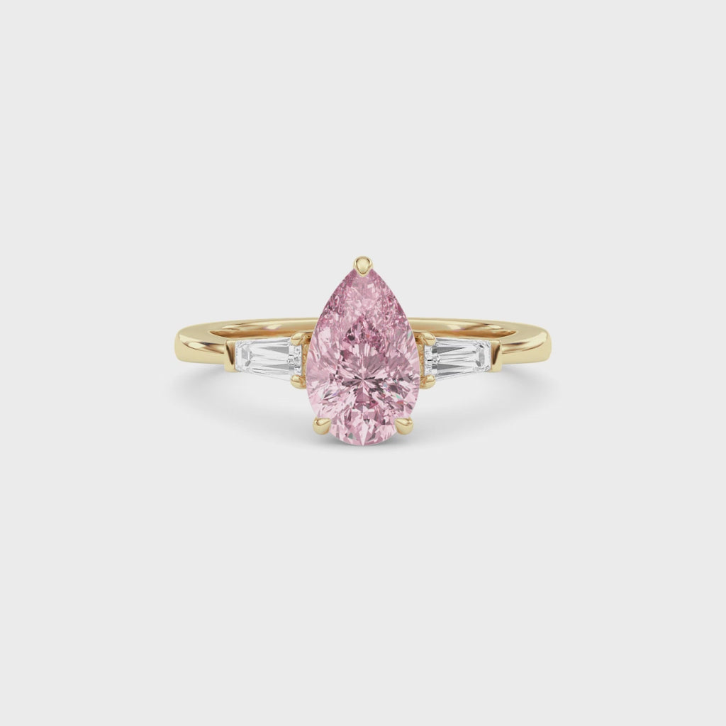 Yellow gold Three-Stone Fancy Pink Pear Cut Diamond Ring with Tapered Baguette Side Stones