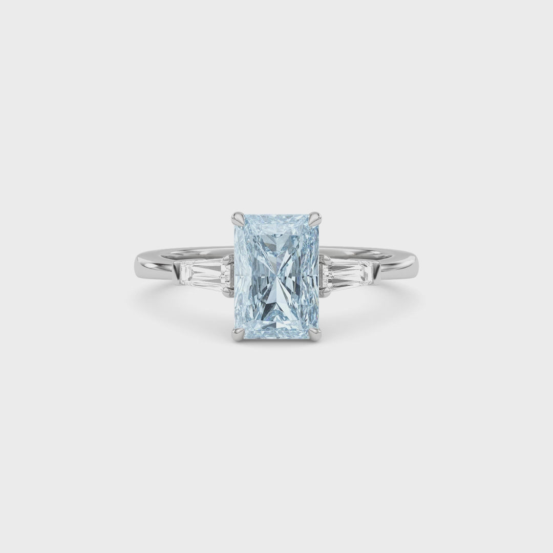 Platinum Three-Stone Fancy Blue Radiant Cut Diamond Ring with Tapered Baguette Side Stones