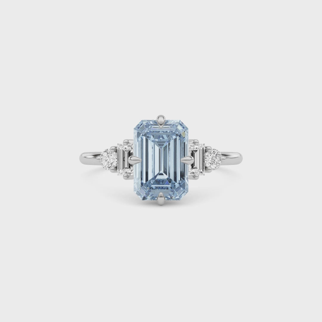 Platinum Fancy Blue Emerald Cut Three Stone Diamond Engagement Ring with Tapered Baguette and Round Side Stones