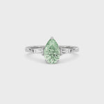White gold Three-Stone Fancy Green Pear Cut Diamond Ring with Tapered Baguette Side Stones