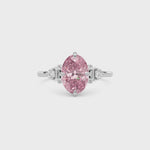White gold Fancy Pink Oval Cut Three Stone Diamond Engagement Ring with Tapered Baguette and Round Side Stones