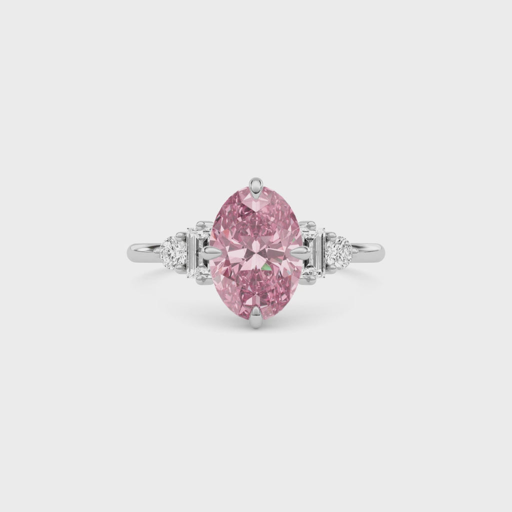 White gold Fancy Pink Oval Cut Three Stone Diamond Engagement Ring with Tapered Baguette and Round Side Stones