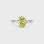 Yellow gold Three-Stone Fancy Yellow Oval Cut Diamond Ring with Tapered Baguette Side Stones