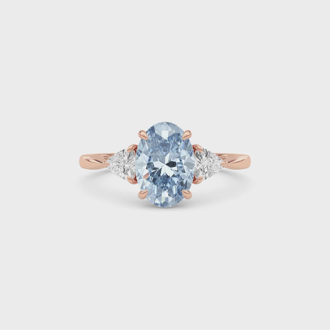 Rose gold Three-Stone Fancy Blue Oval Cut Diamond Ring with Trillion Side Stones