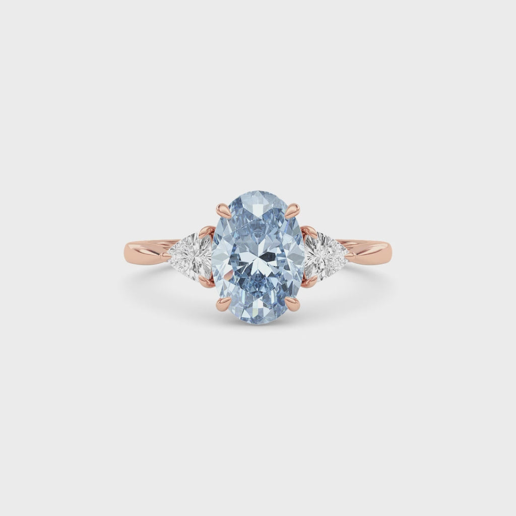 Rose gold Three-Stone Fancy Blue Oval Cut Diamond Ring with Trillion Side Stones