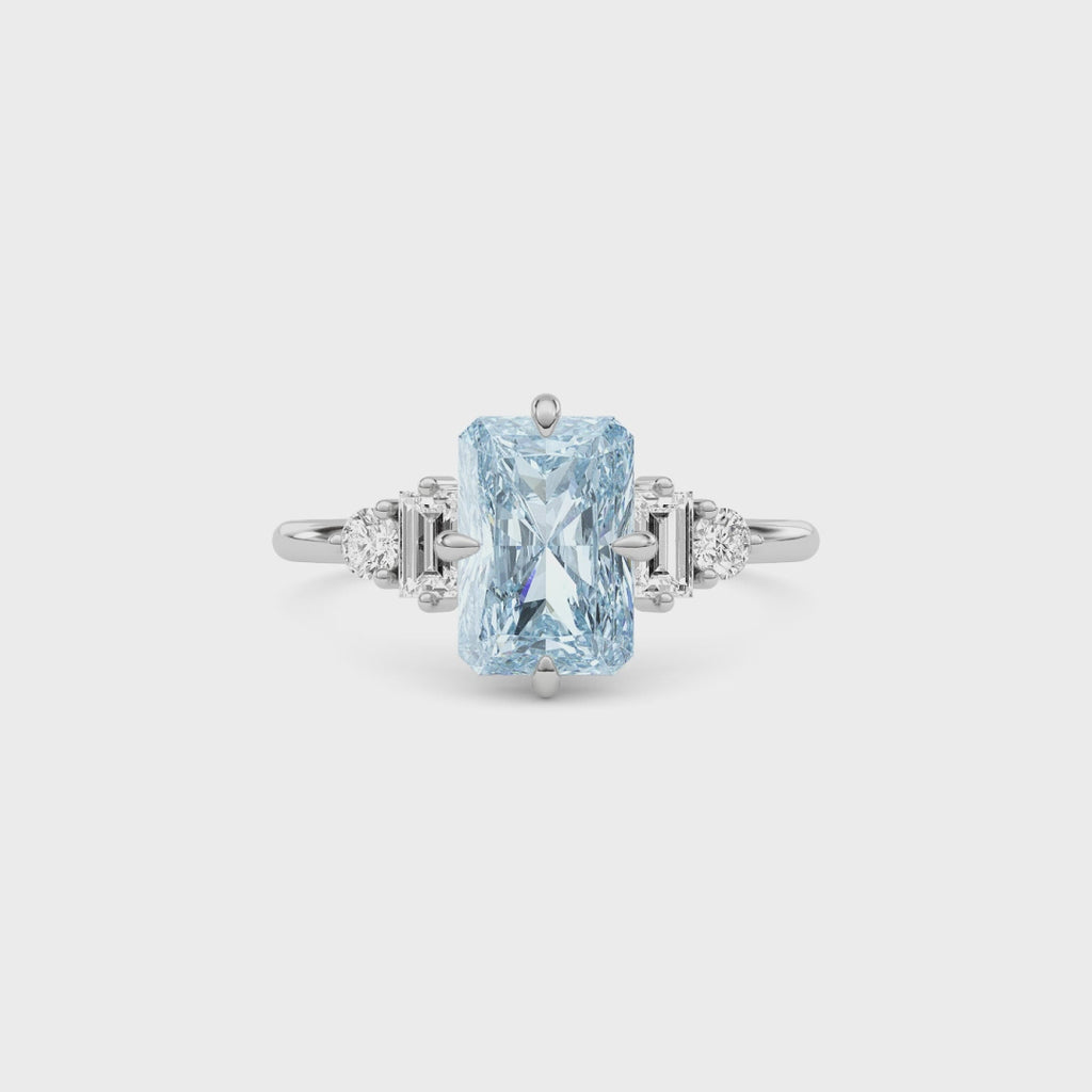 Silver Fancy Blue Radiant Cut Three Stone Diamond Engagement Ring with Tapered Baguette and Round Side Stones
