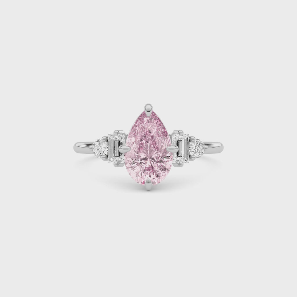 Platinum Fancy Pink Pear Cut Three Stone Diamond Engagement Ring with Tapered Baguette and Round Side Stones