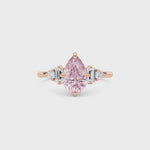 Rose gold Fancy Pink Pear Cut Three Stone Diamond Engagement Ring with Tapered Baguette and Round Side Stones