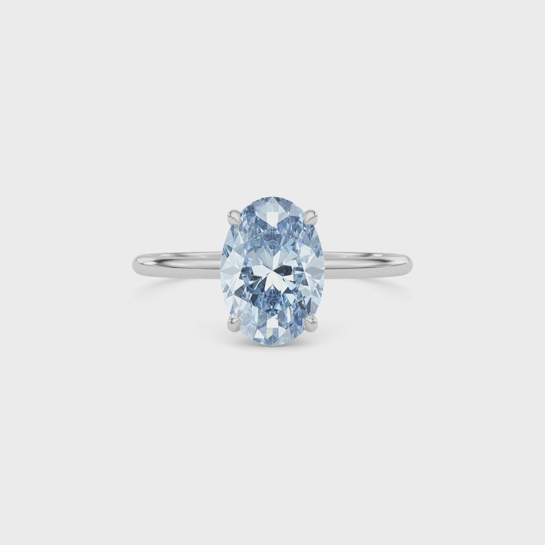 White gold Fancy Blue Oval Cut Diamond Hidden Halo Solitaire Engagement Ring with Prong Setting