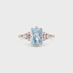 Rose gold Fancy Blue Radiant Cut Three Stone Diamond Engagement Ring with Tapered Baguette and Round Side Stones