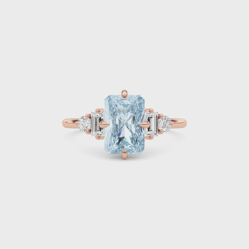 Rose gold Fancy Blue Radiant Cut Three Stone Diamond Engagement Ring with Tapered Baguette and Round Side Stones