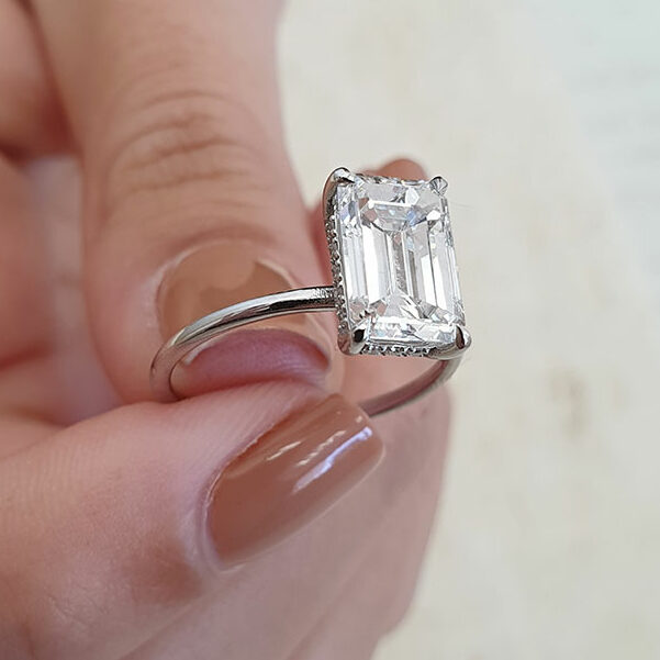 DB Classic emerald-cut diamond ring | De Beers US